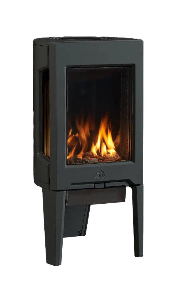 Petit poêle au gaz moderne en fonte avec média de petites roches et avec des panneaux de verre noir réfléchissants