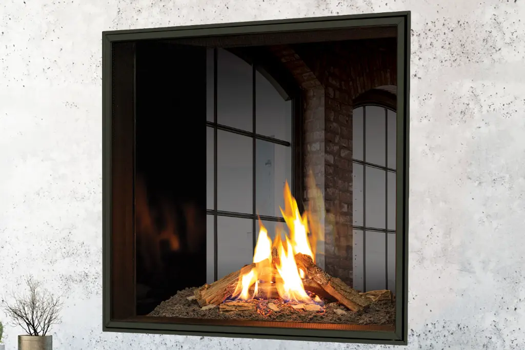 Vue à travers le foyer au gaz double face (See-Thru) Urbana U33, montrant l'effet de transparence et la connexion entre deux espaces.