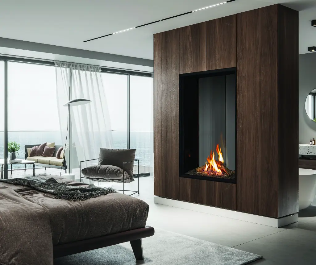 Foyer au gaz double face vertical Urbana U33 Tall, séparant une chambre des maîtres et une salle de bain avec une finition en boiseries de noyer.