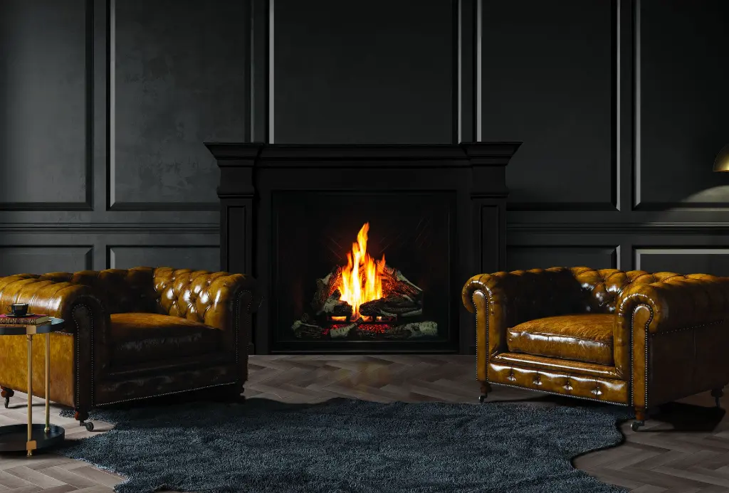 Ambiance feutrée de style "Gentleman's Club" avec le foyer au gaz Urbana U44, intégré dans un manteau et un mur noirs avec des fauteuils en cuir brun.