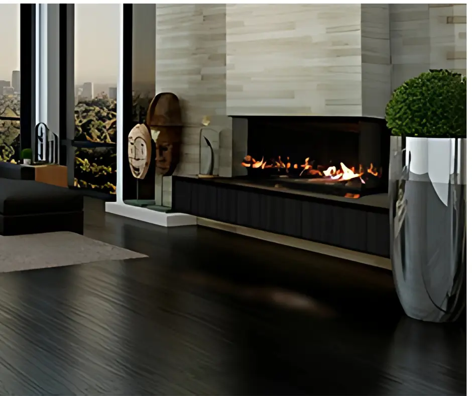 Look contemporain avec le foyer de coin au gaz Galaxy 48 et son lit de pierres, encastré dans un mur de lattes de bois pâles.